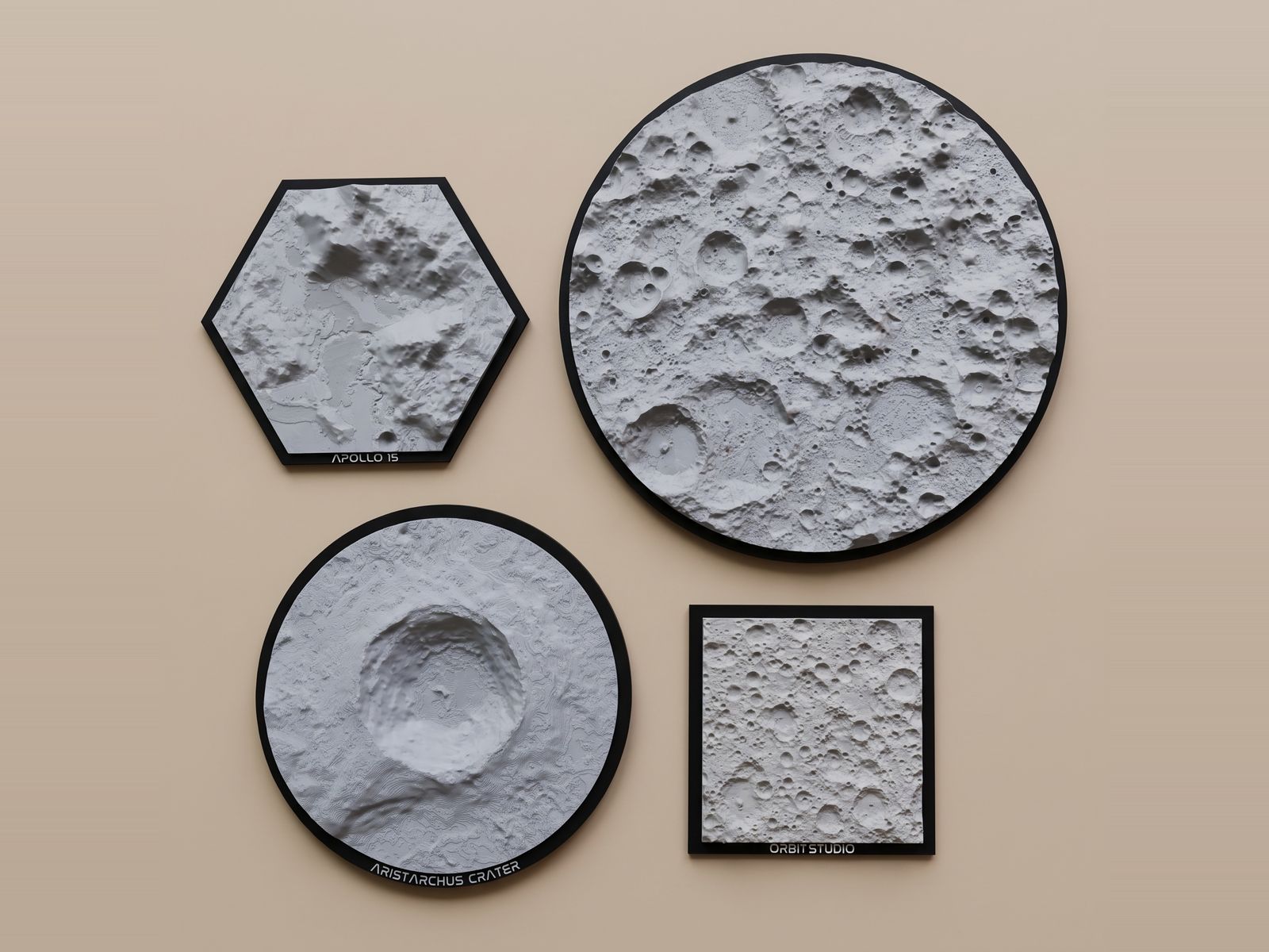 Four printed Moon ornaments on a peach wall: a hexagon, two circles and a square